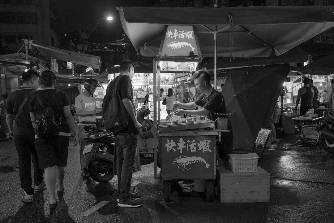 a person selling food at an outdoor market