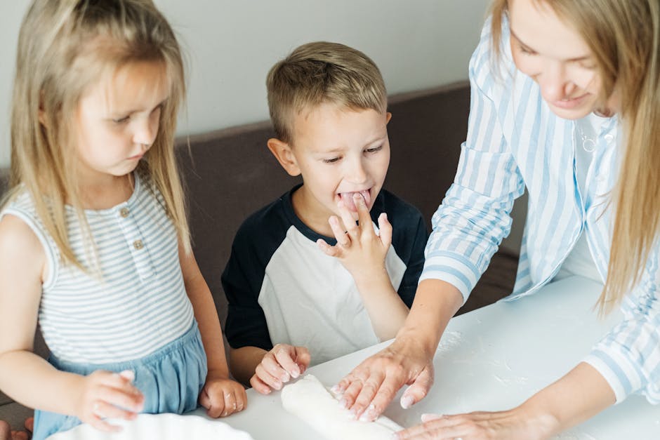 Mother and children enjoying cooking together, creating happy memories in the kitchen.
