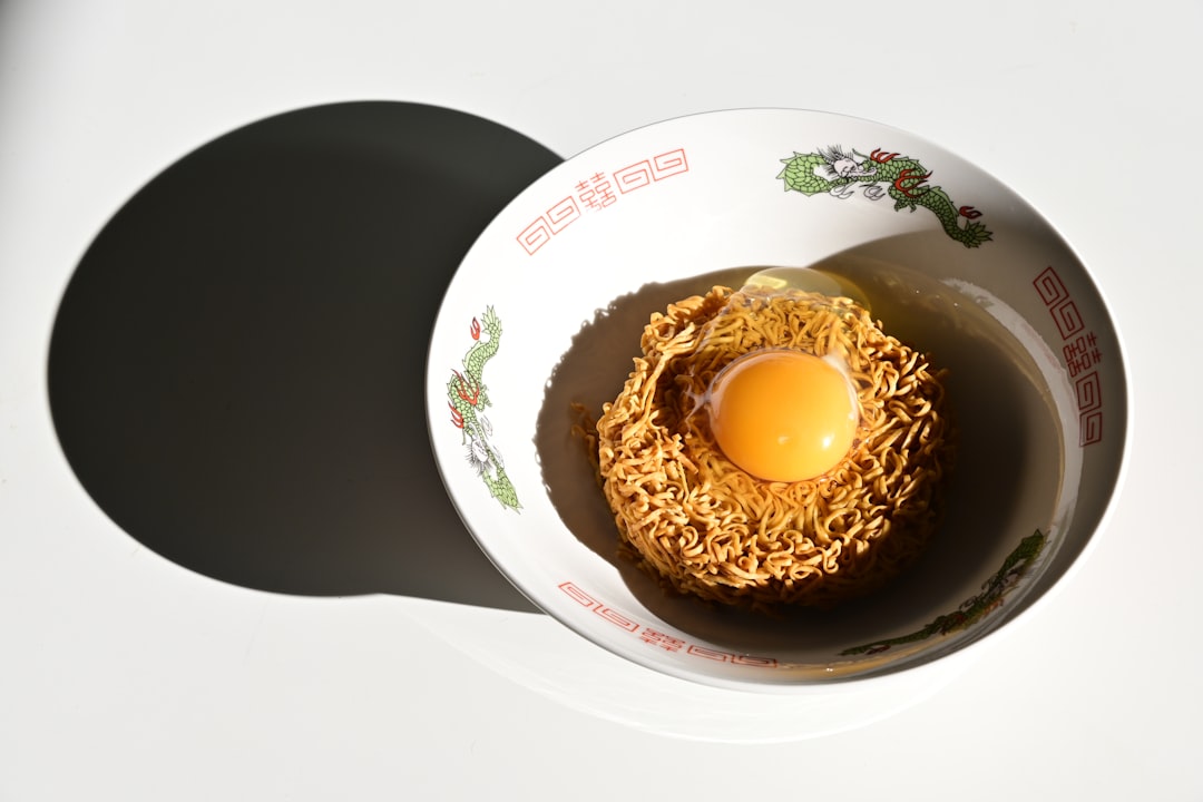 An egg in a bowl on a table