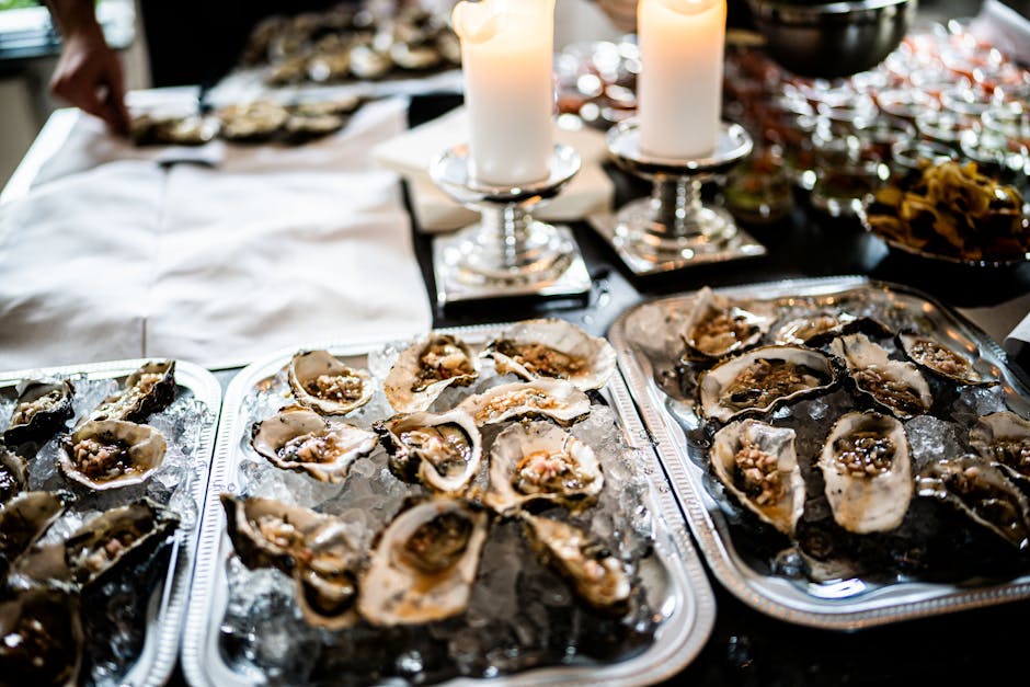 Indulge in a luxurious seafood dining experience with a candlelit oyster spread.