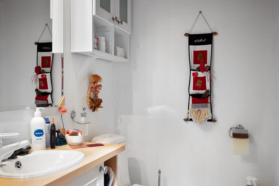 A modern, minimalist bathroom featuring Scandinavian-style decor and a functional white vanity.