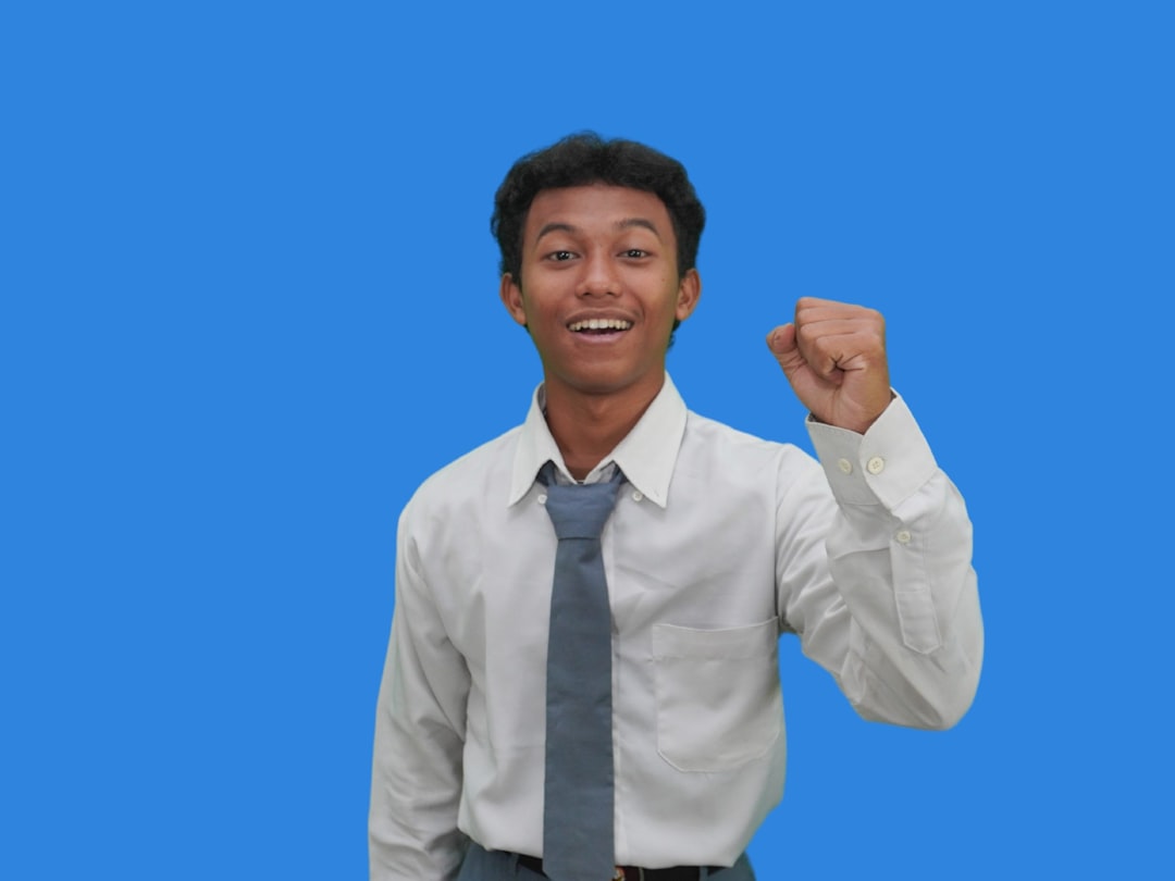 A man in a white shirt and gray tie