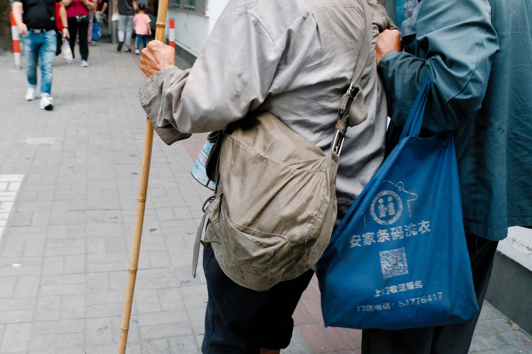 a couple of people walking down a street