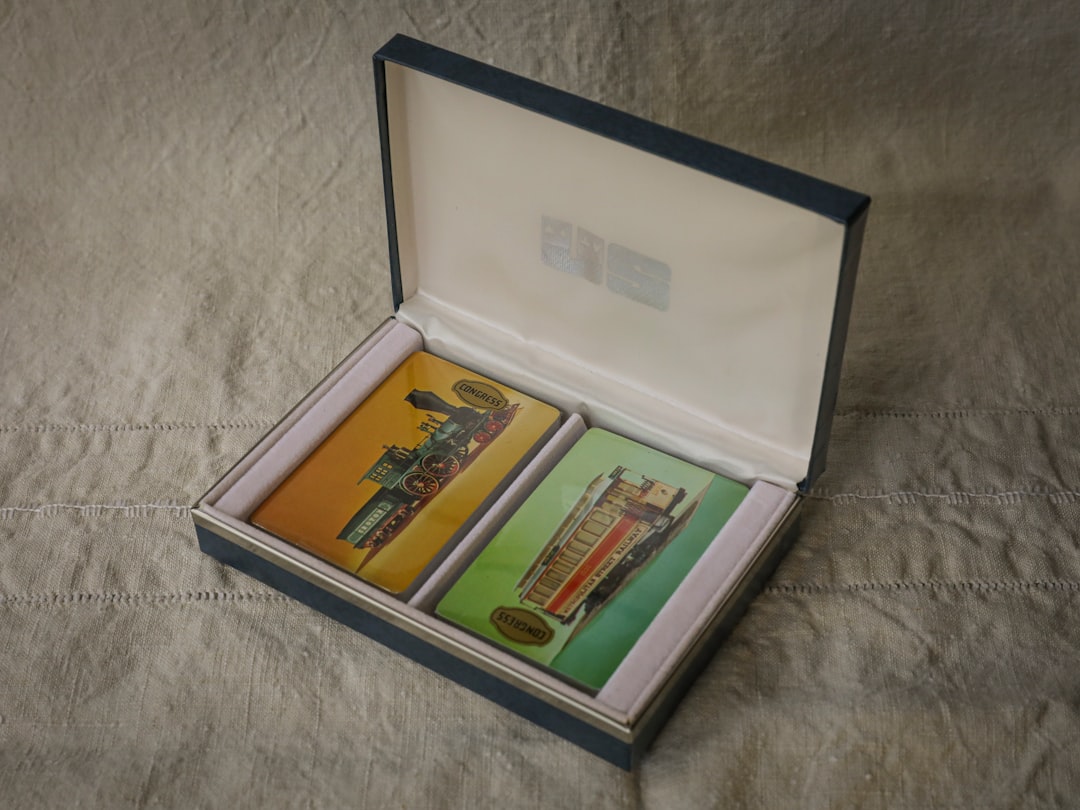 a couple of cards in a box on a bed